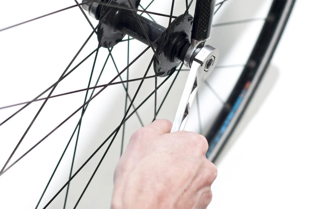 box head spanner of nutter cycle multi tool being used on 15mm axel nuts