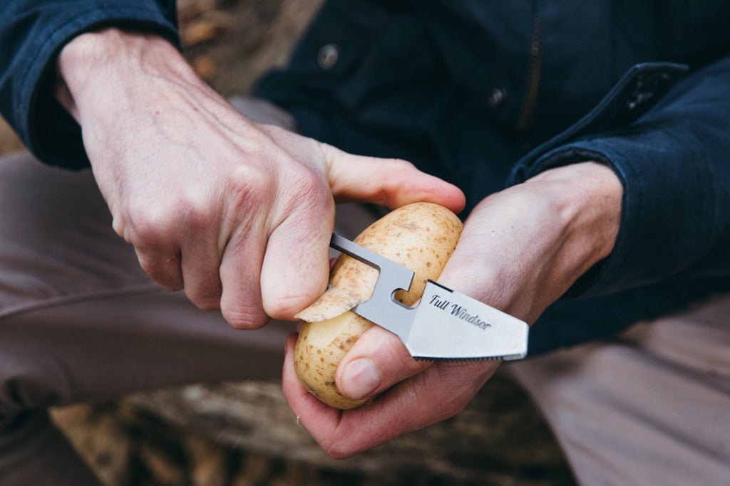 the muncher titanium multi utensil peeling a potato